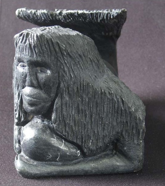 A carving of Sedna with tangled hair: a maternal personification of the Jung's collective unconscious