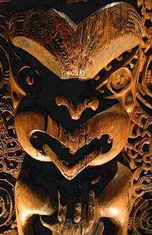 Wood carving of angry female with furrowed brow and flared nostrils. jungian therapy